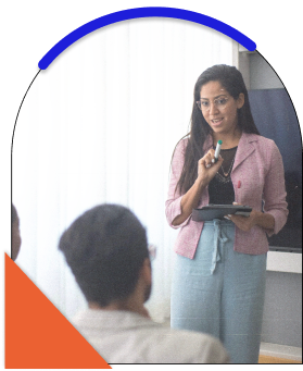 A picture of a lady speaking to someone sitting down